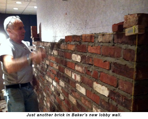 Another brick in Baker's new lobby wall